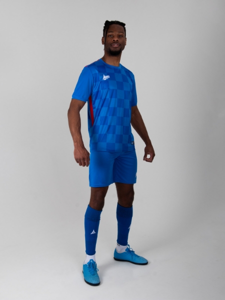 Adult Model is wearing a Two-Tone Royal Blue Chequered Football Shirt with red side panels, blue shorts and blue socks by Avec Sport