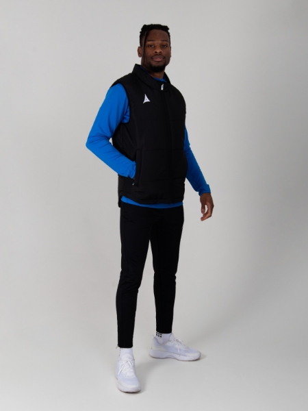 This adults padded gilet in black is being worn with a royal blue jumper and black joggers