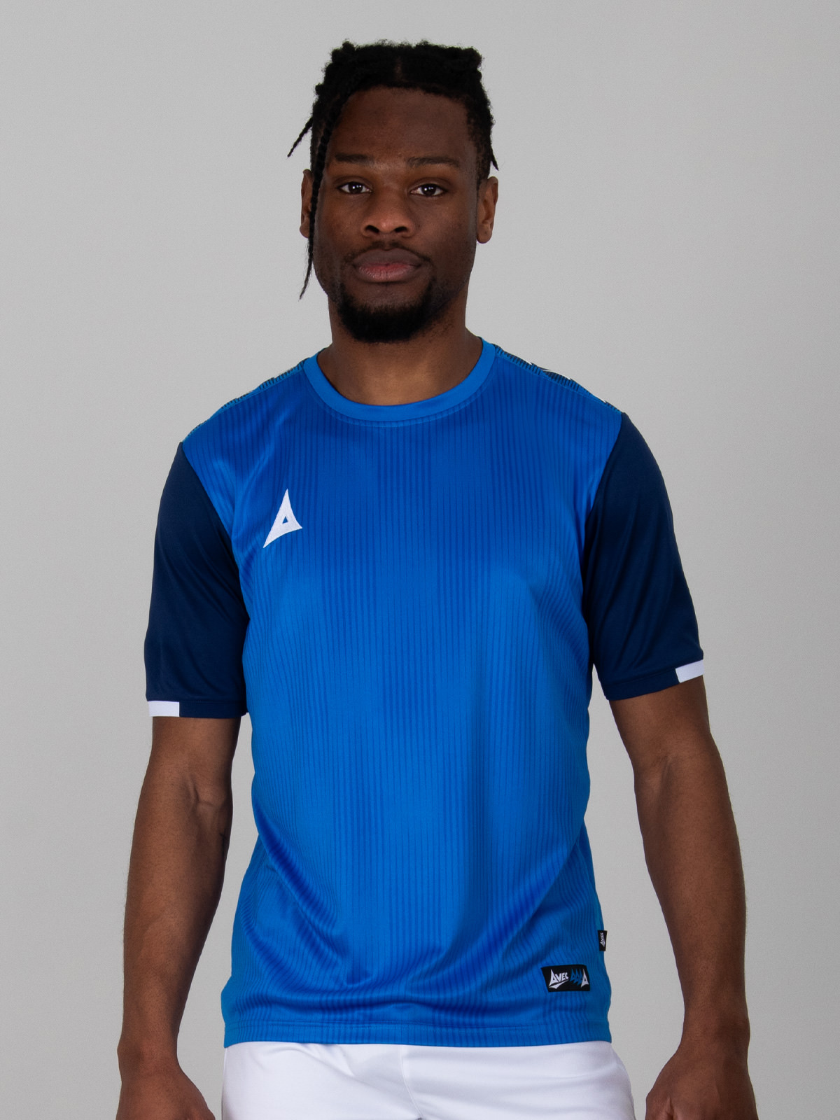 a royal blue football shirt with graphic print, is complimented with navy sleeves.