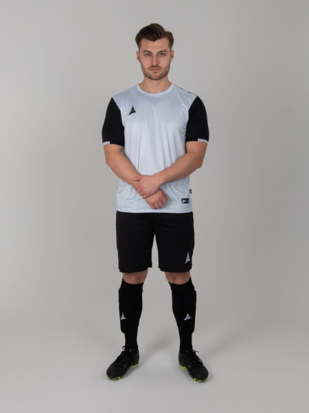 A Grey Football Shirt is worn with black shorts and socks to match the sleeves of the top.