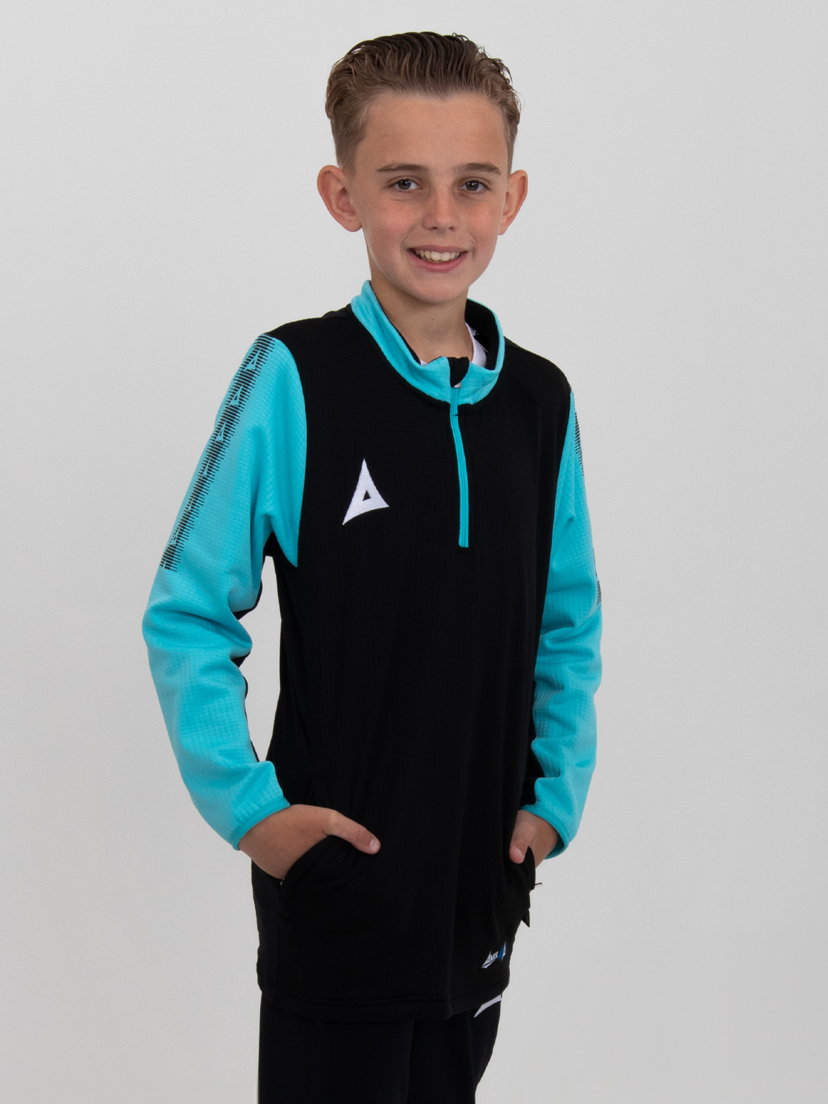 a young child is wearing a black quarter-zip jumper with light blue sleeves