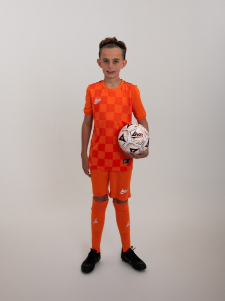 An orange football kit is worn with children's orange shorts