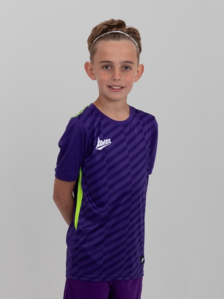 A kids purple football shirt with neon yellow details is being worn by a young child.