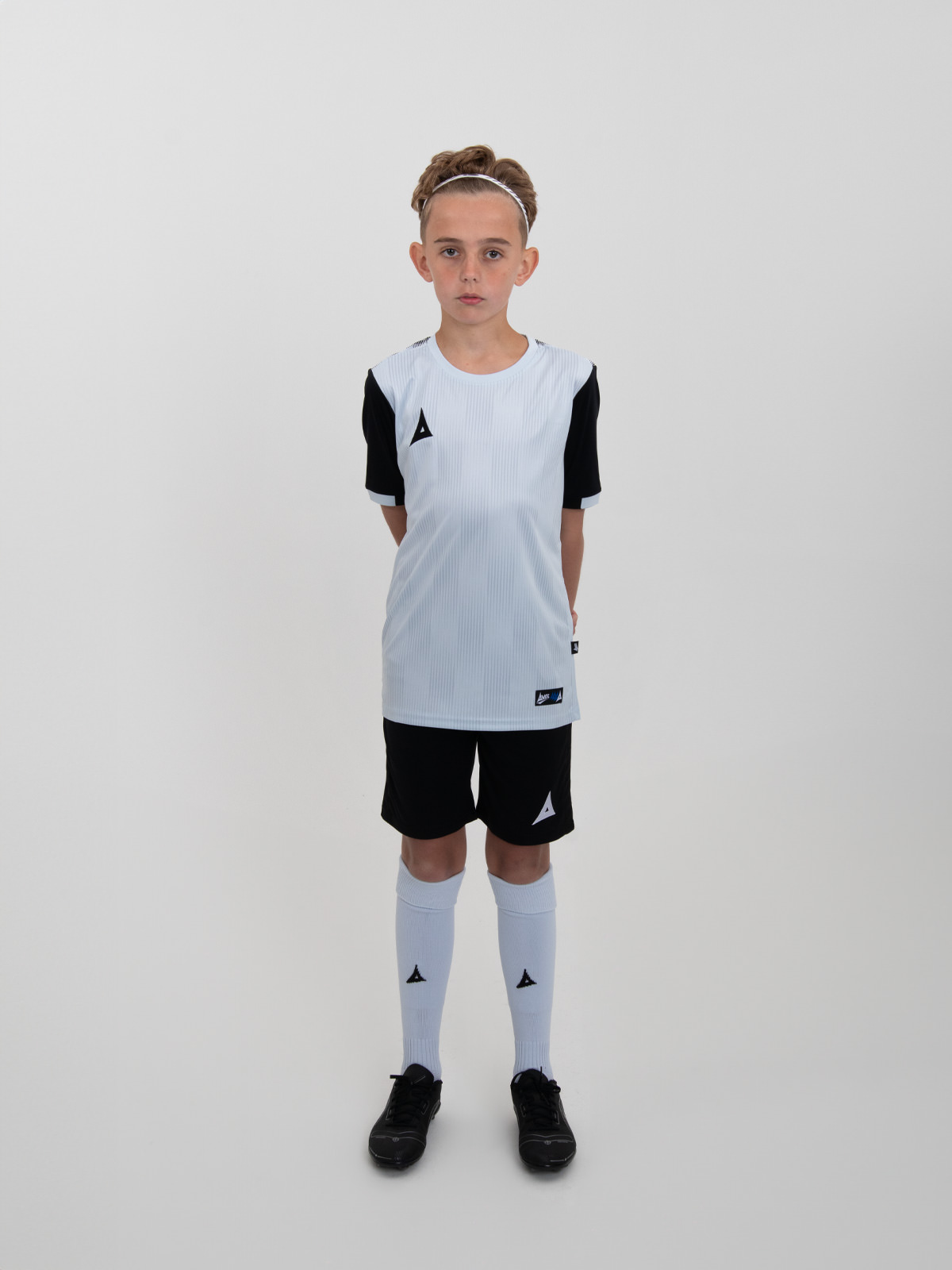 a grey football shirt with black shorts and grey socks makes a winning combination for any kids football team.