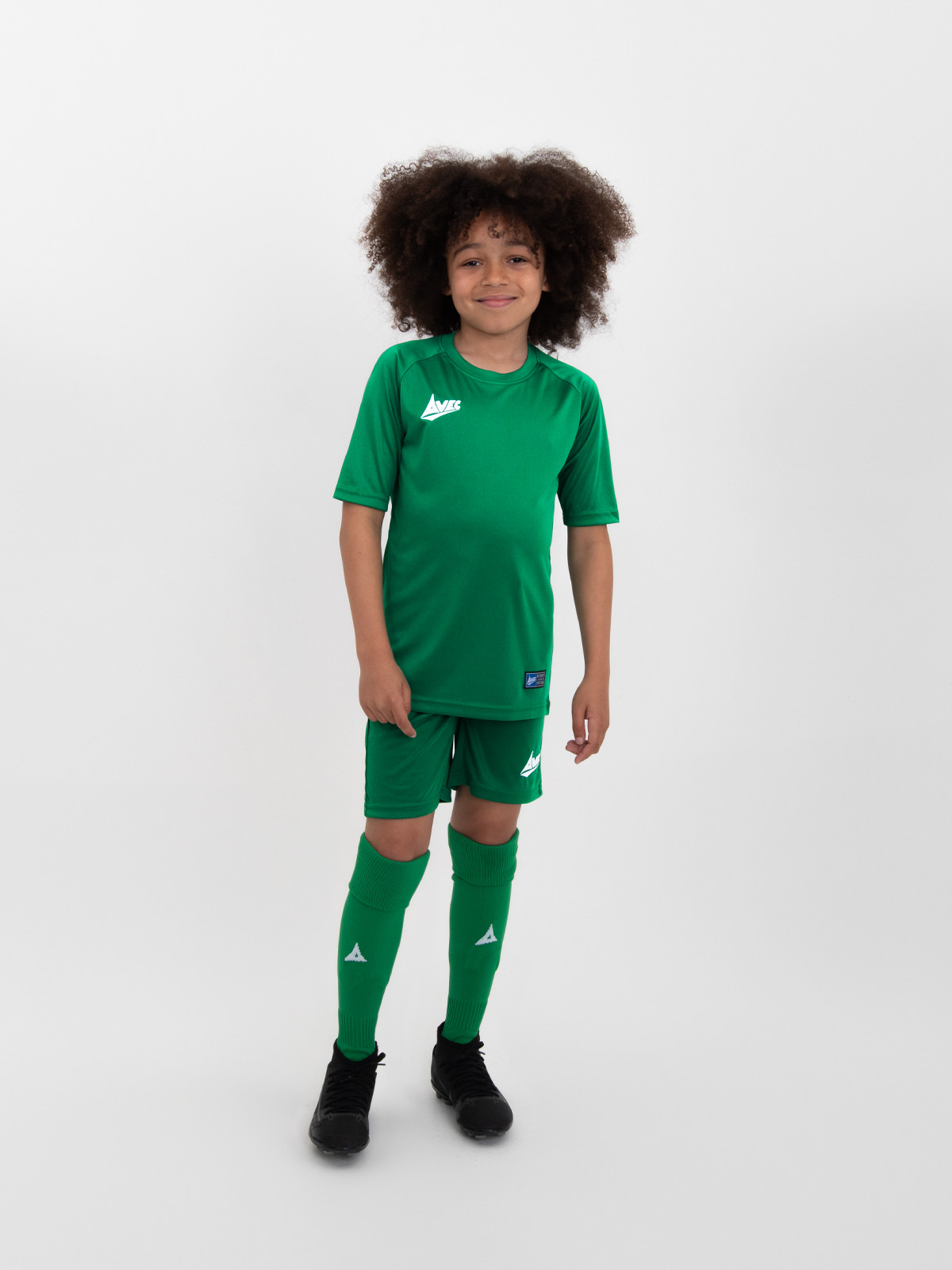 a child is wearing a full green kit from our classic range.