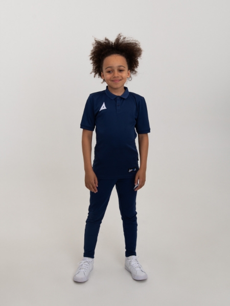 A childrens navy polo shirt is being worn with a junior pair of tracksuit bottoms for a smart combination