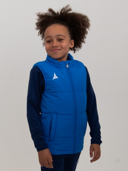 A young boy is wearing a royal blue padded gilet