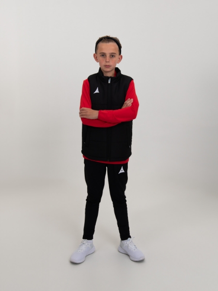 A kids padded gilet in black is worn to keep the child warm