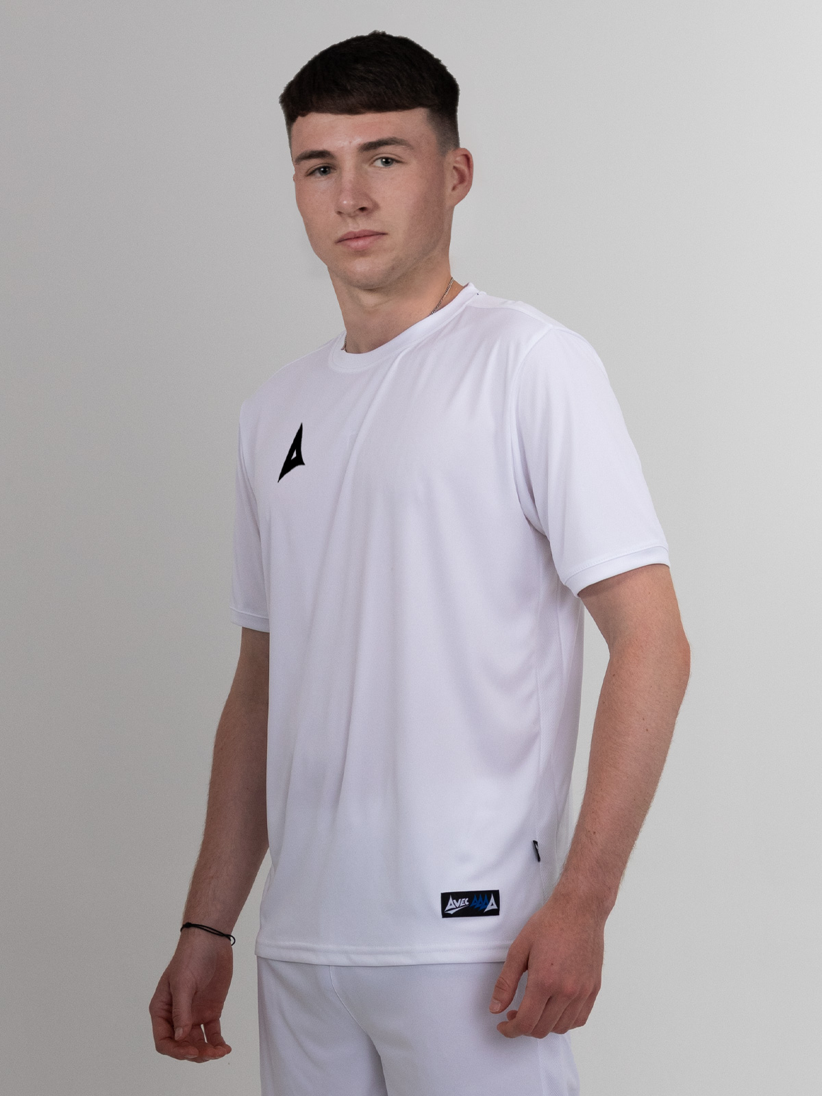 a classic white football shirt with black logo can be worn with white shorts or black shorts