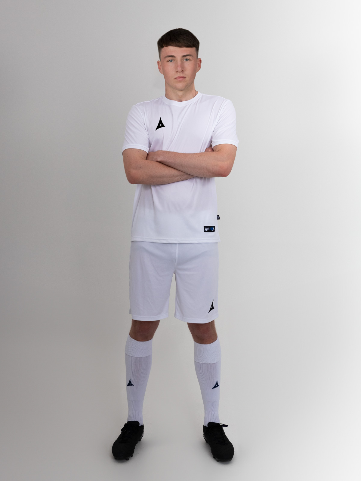 the person in the shoot is wearing a full white kit, but the shirt can also be worn with black shorts