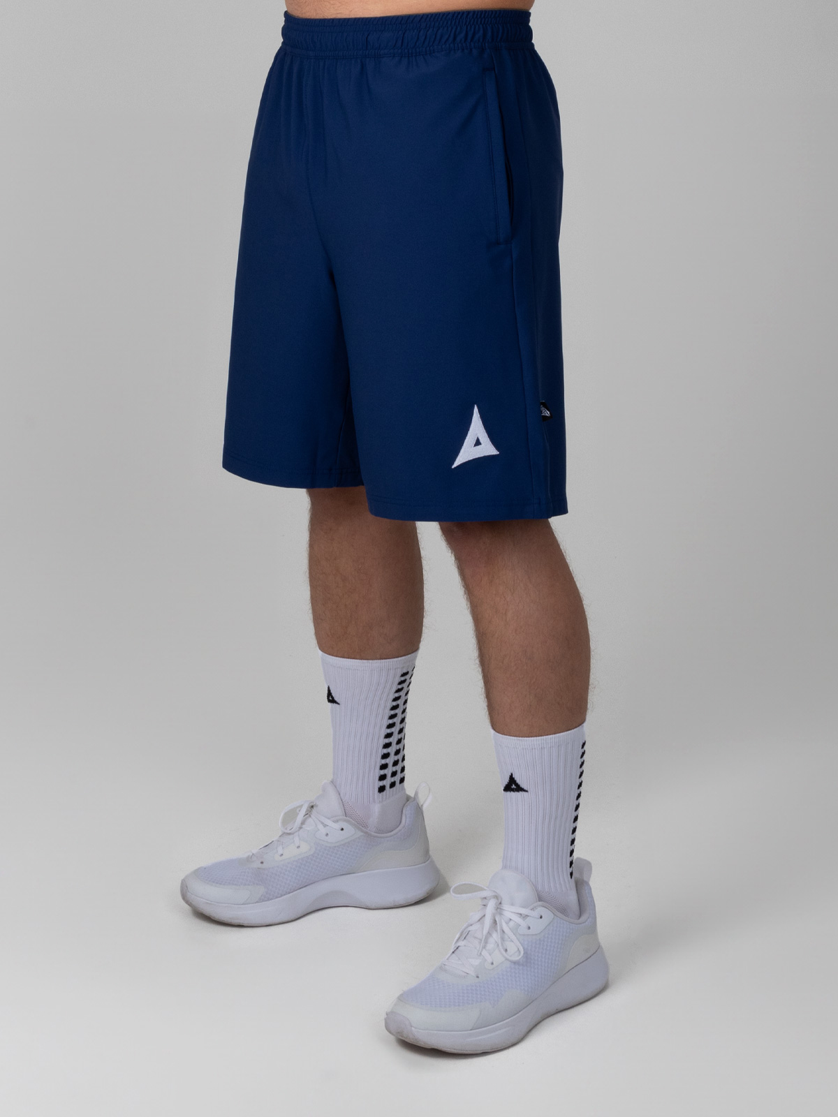 this man is wearing the focus classic navy blue tech shorts, which are ideal for training.