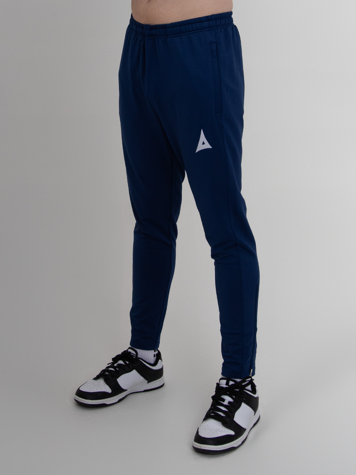 navy blue slim fit tracksuit bottoms for football are being worn