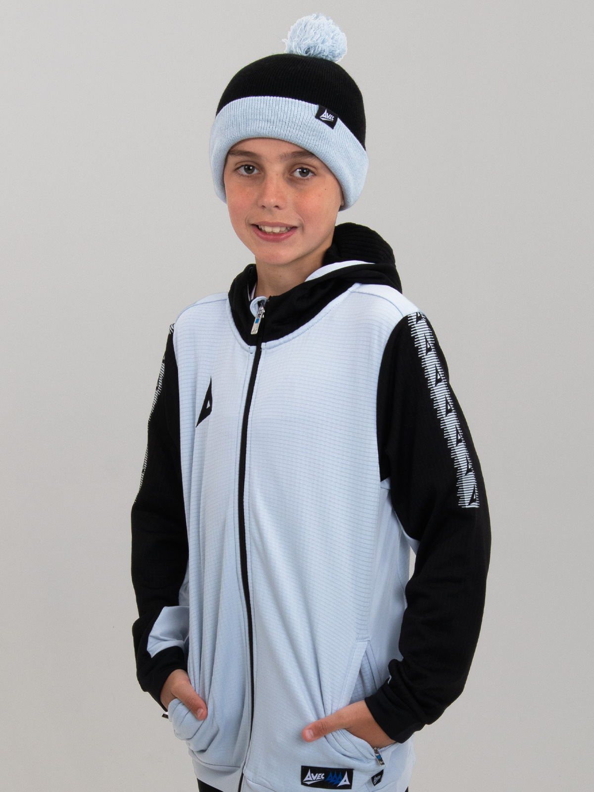 a kids beanie hat in black and grey, which is designed to be worn with our grey pro player collection