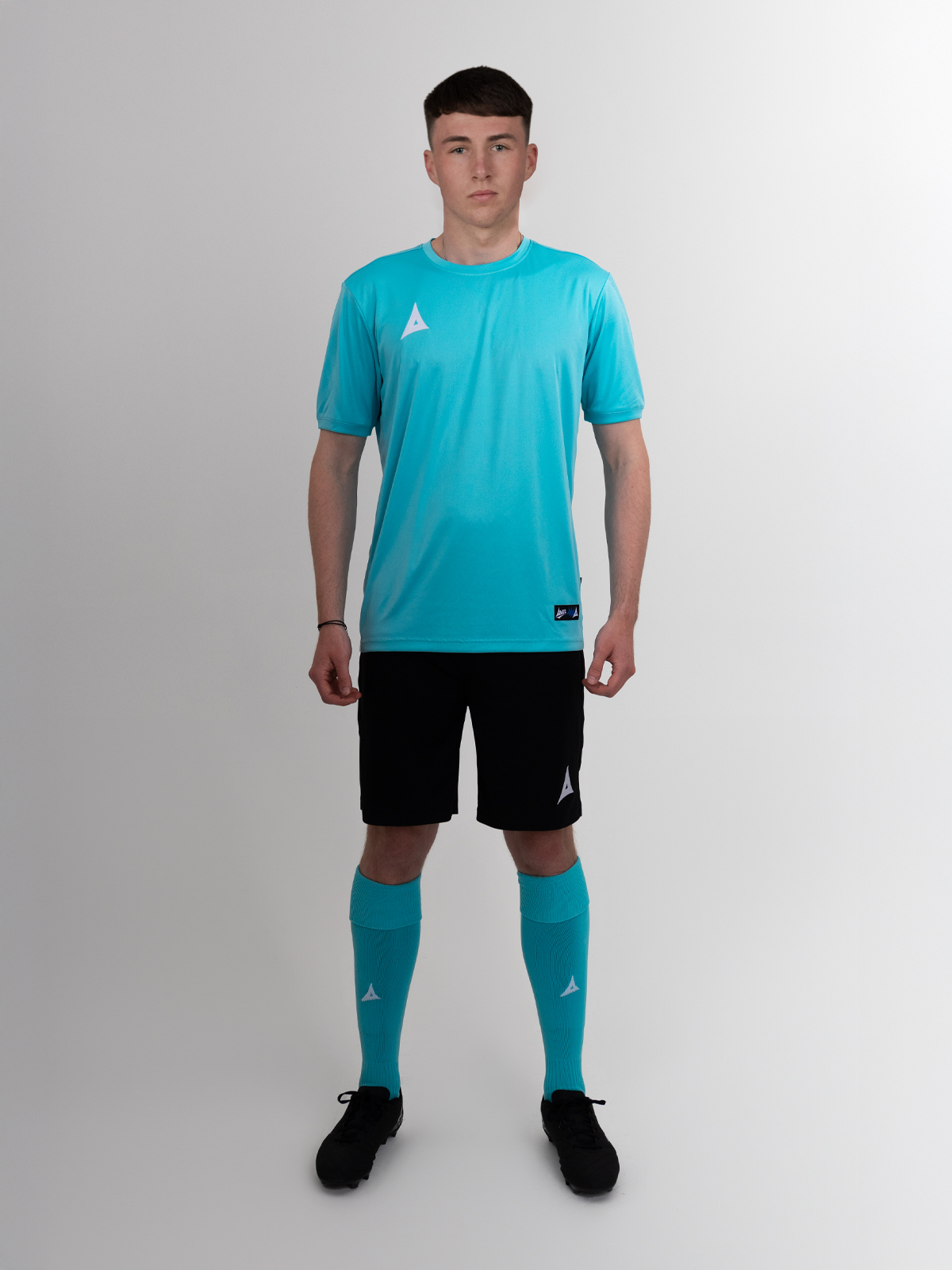 a full football kit in a light blue and navy is being worn