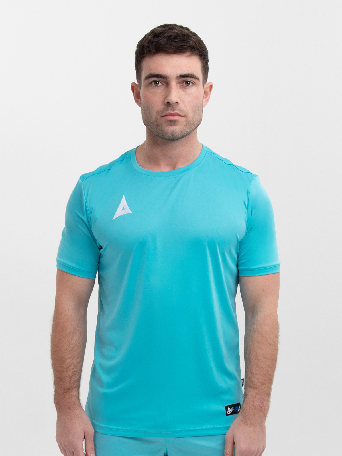 a man wearing a pale blue football shirt