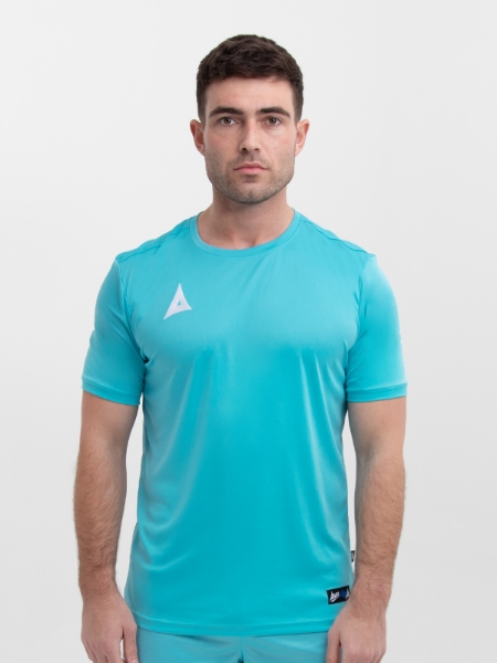 A man wearing a pale blue football shirt