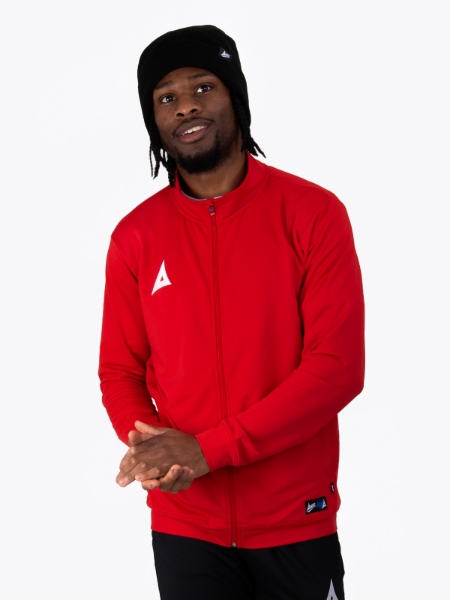 A Man wearing a black beanie hat with a red track jacket and black tech pants
