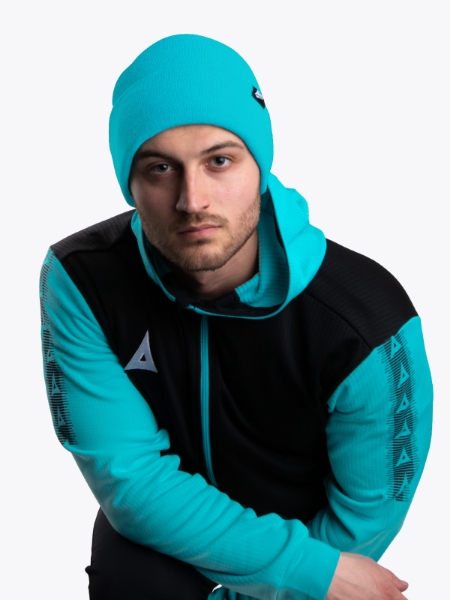 This man is wearing a bright blue hat with a turn up