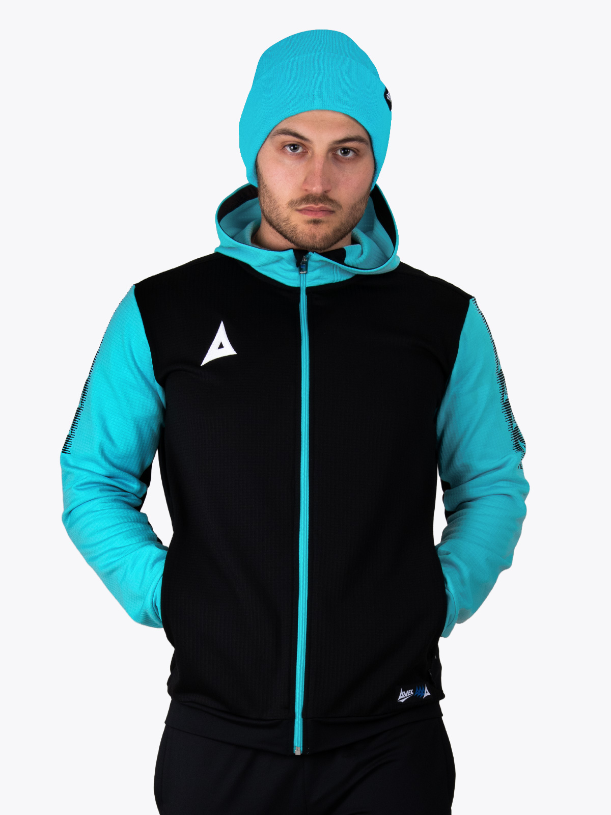 this man is keeping warm with the blue turn up hat