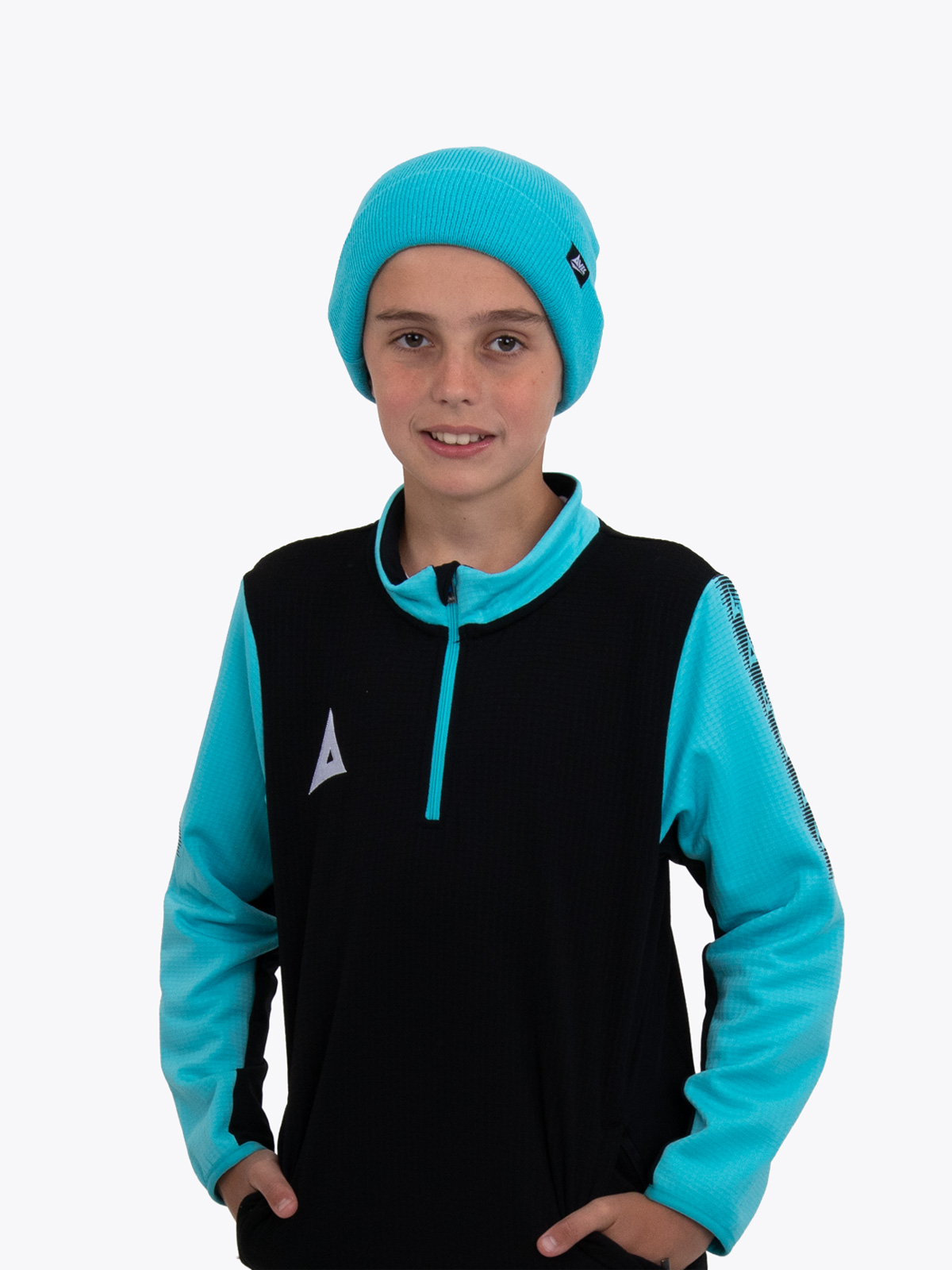 this boy is keeping warm with the blue turn up hat 