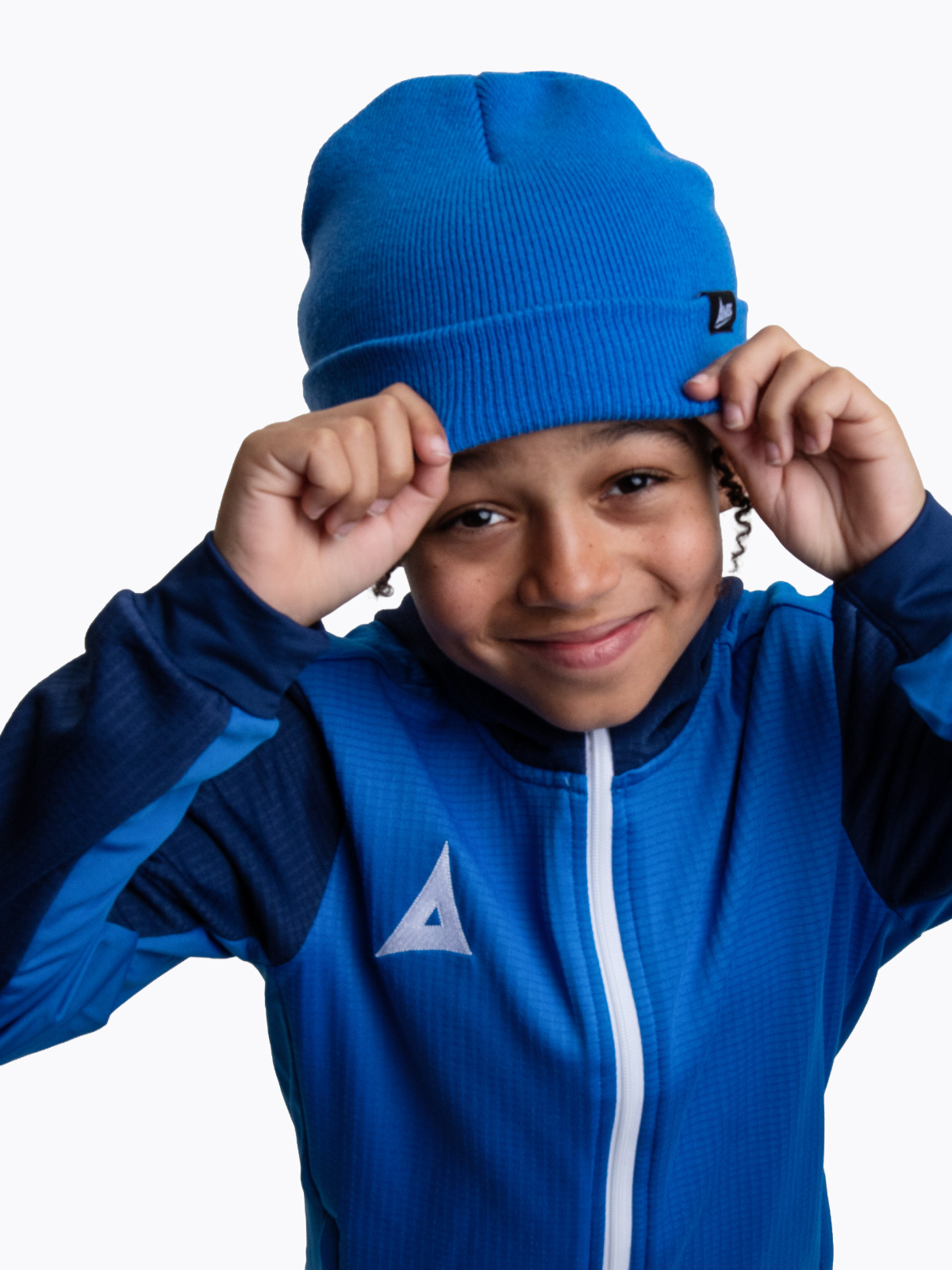 a child keeping warm wearing a royal blue turn up bronx beanie