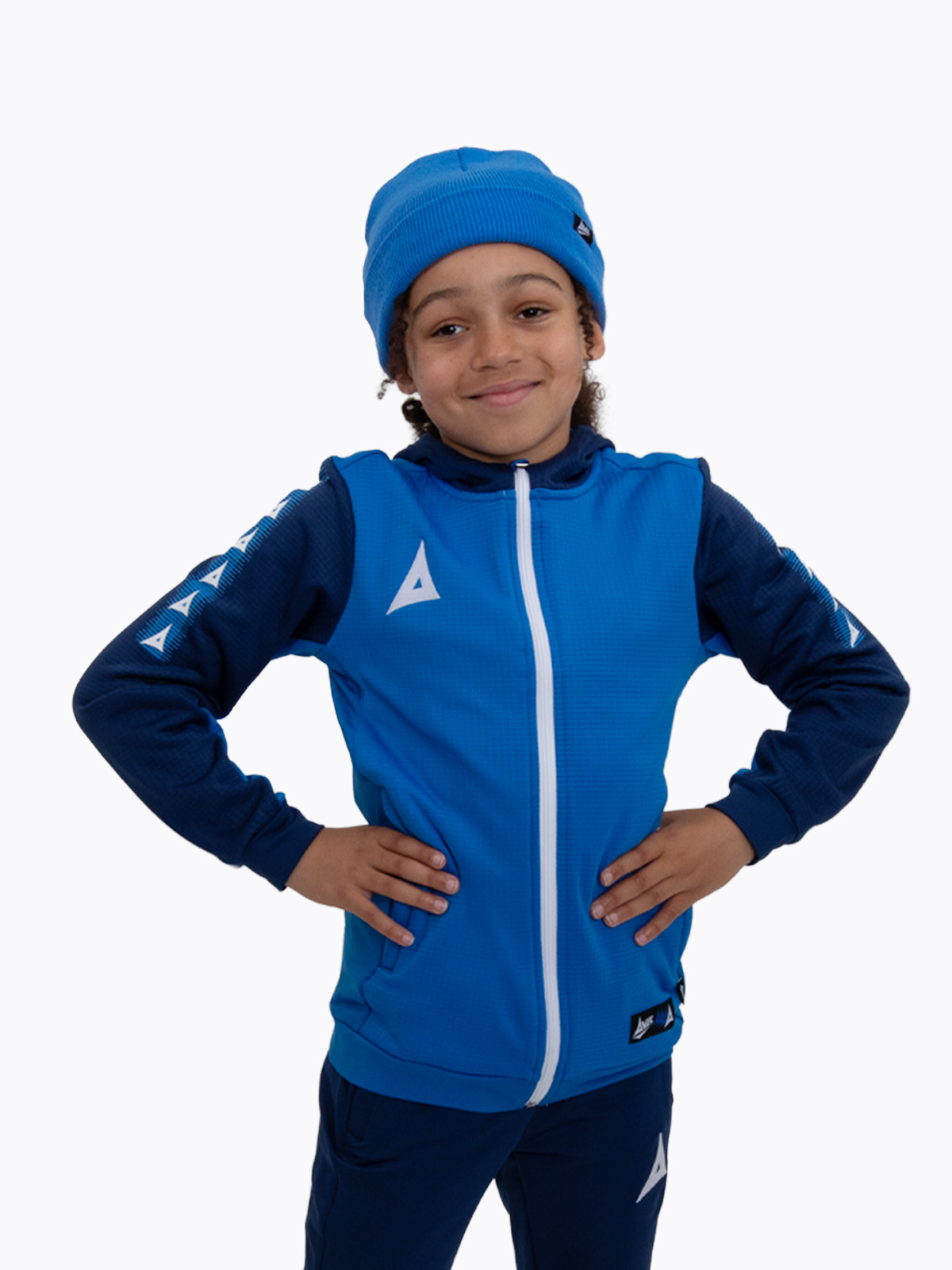 a child keeping warm wearing a royal blue turn up bronx beanie