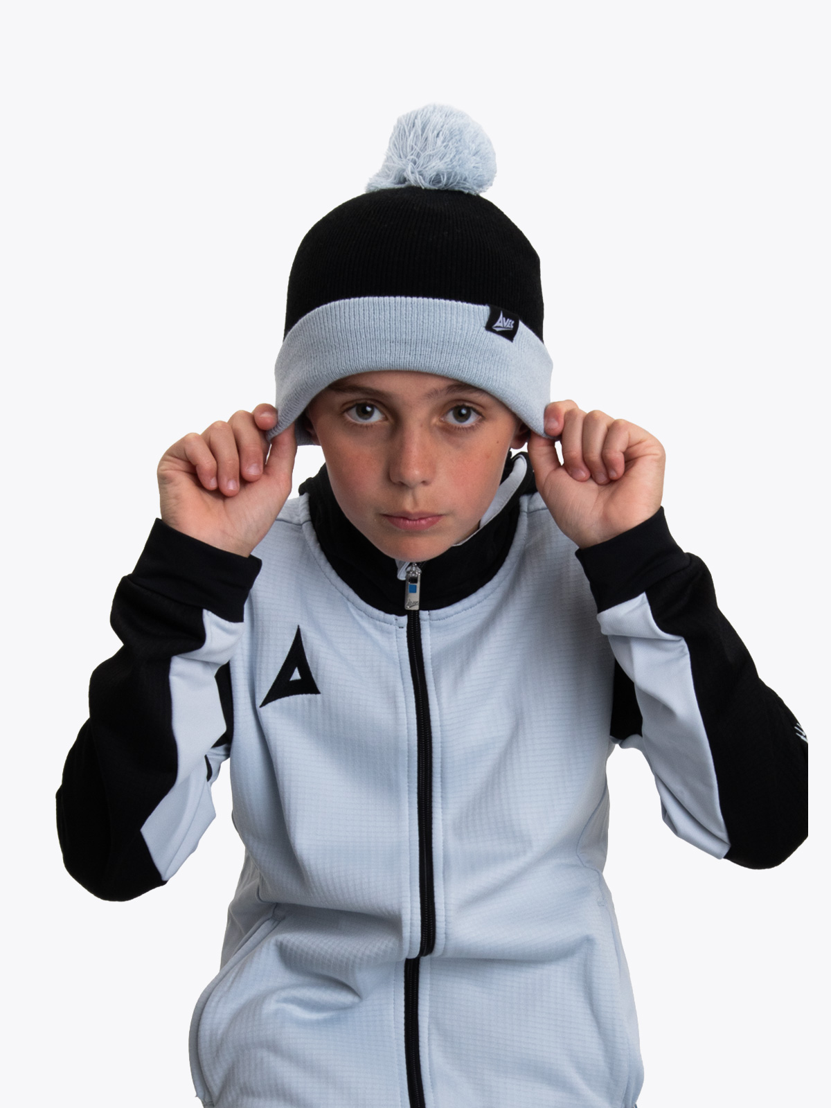 a child is wearing a junior beanie hat in black and grey.