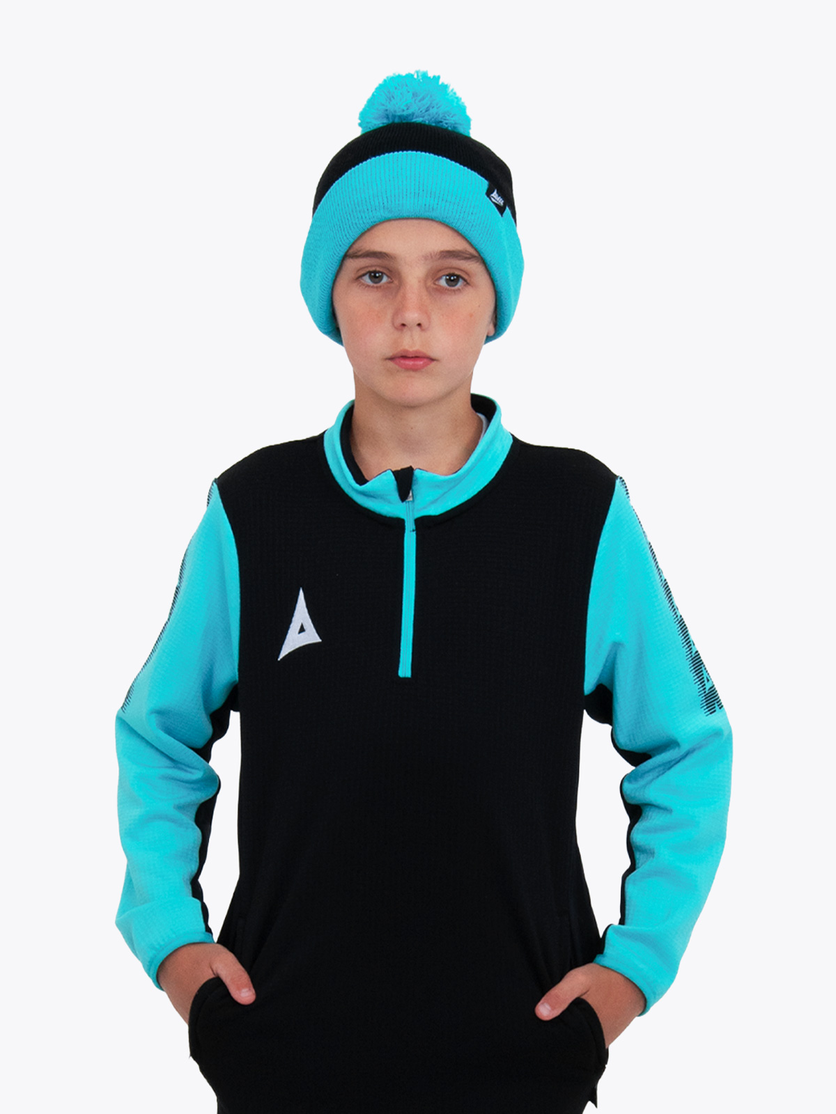 a junior is wearing a black and light blue bobble hat, with a matching overlay jumper.