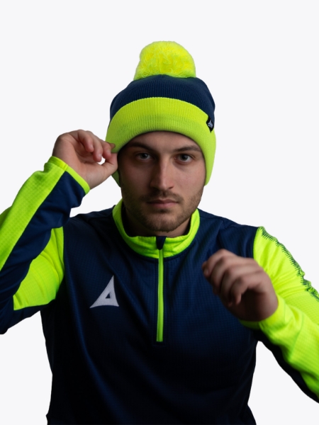 Person Wearing Dark Blue and Neon Yellow Beanie and Athletic Jacket
