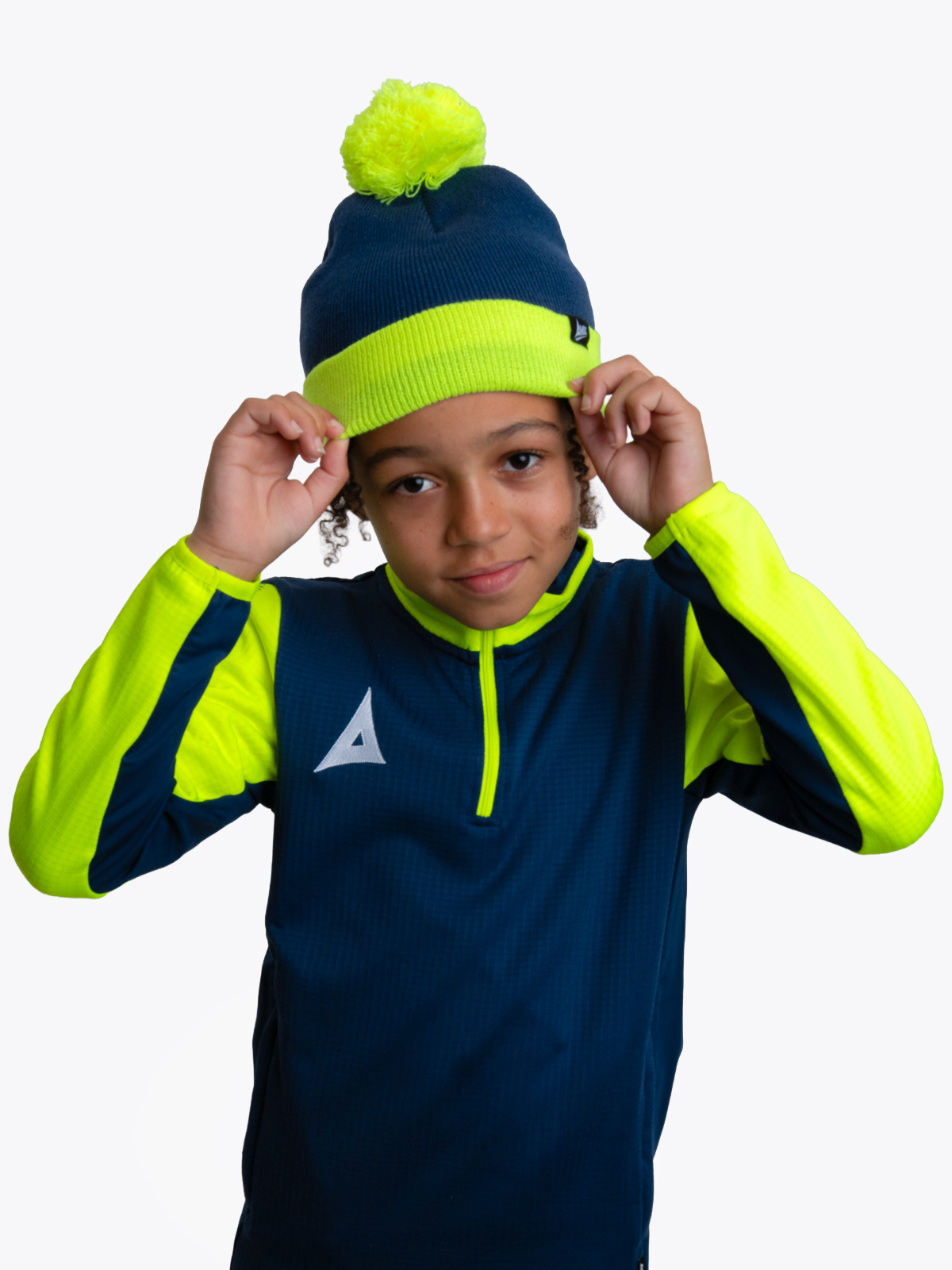 person wearing navy blue and neon yellow athletic outfit
