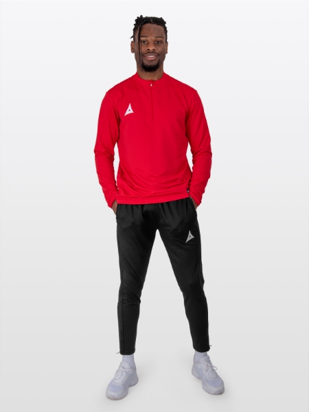 A Male Model is stood wearing the Avec Focus 2 Red Tech Overlay, Plain Red Jumper / Overlay with a Quarter Zip and the Avec Focus 2 Black Track Pant