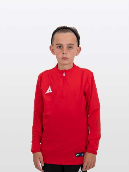 A boy is stood wearing the Avec Focus 2 Red Tech Overlay, Plain Red Jumper / Overlay with a Quarter Zip