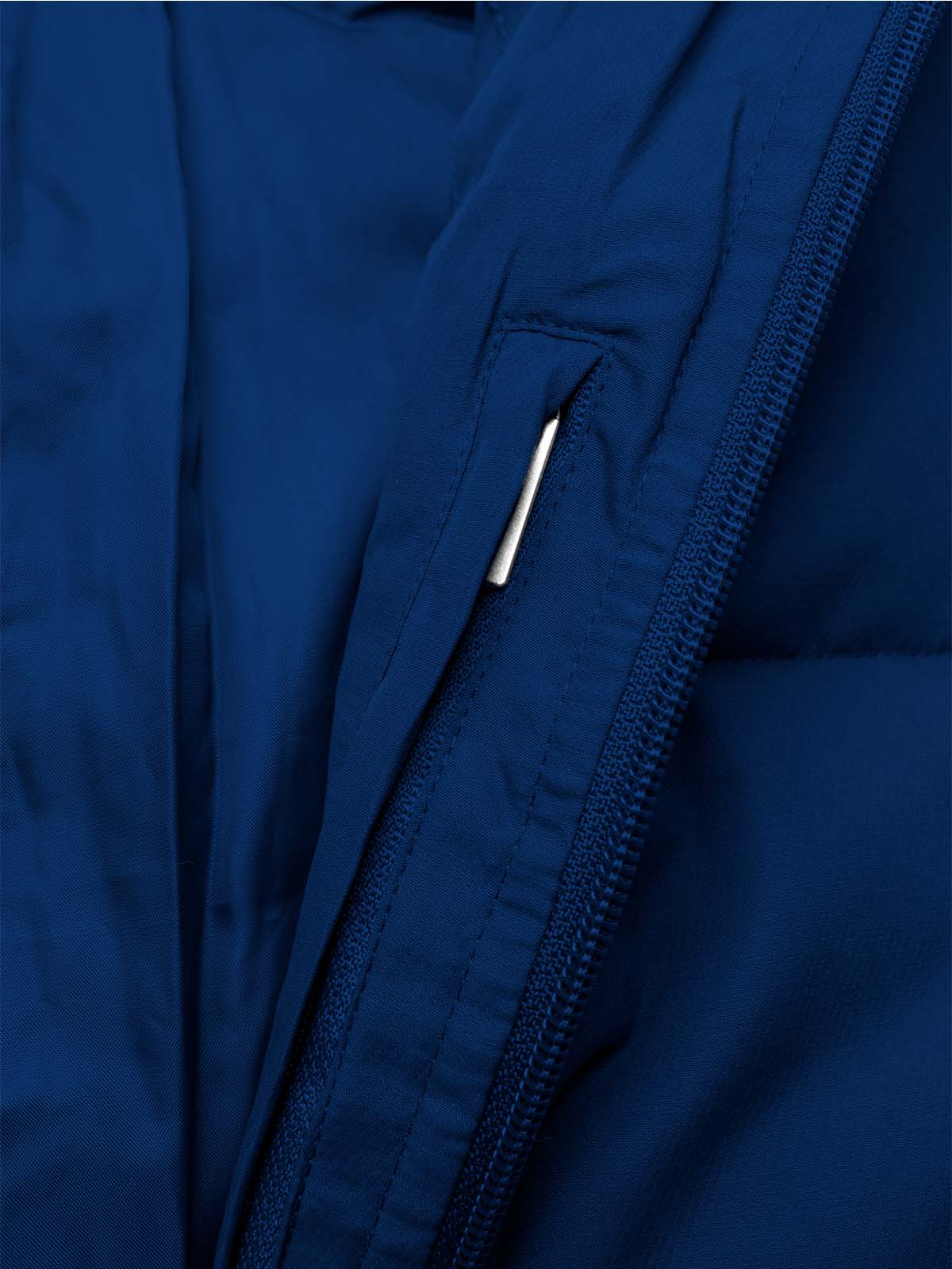 close up of the concealed pocket of the avec evolve pro padded jacket in navy