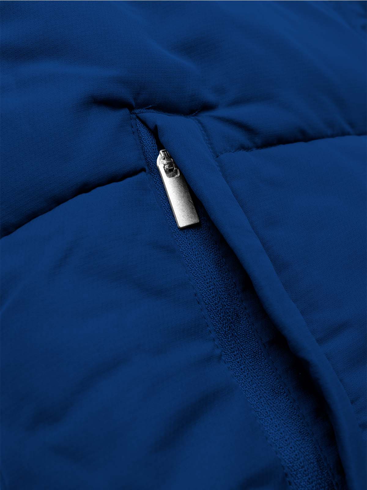 close up of the side seam zipped pockets of the avec evolve pro padded jacket in navy