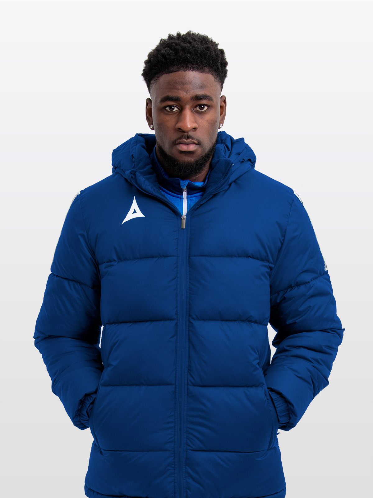 male model wearing the avec evolve pro padded jacket in navy featuring sewn-in panel detailing and medium padding for a refined, insulated fit.