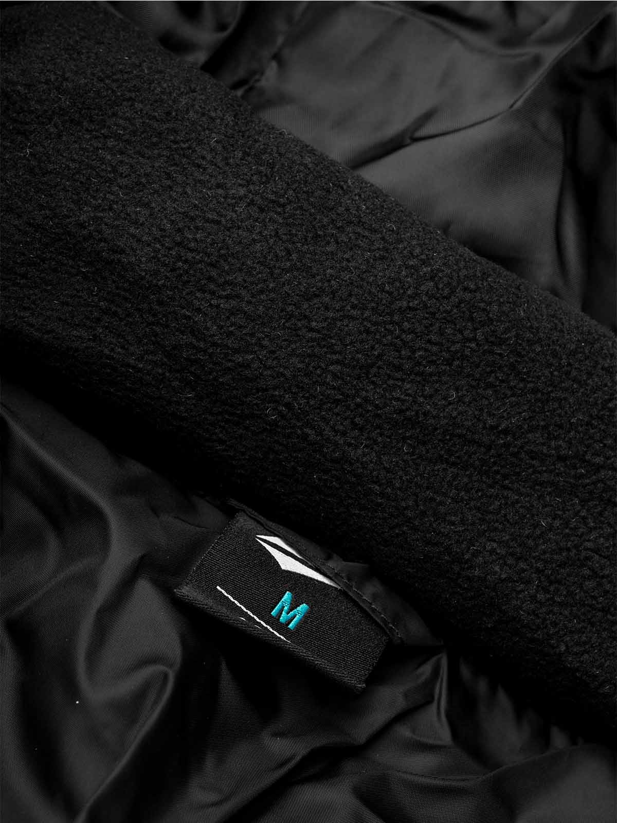 close up of the inner warm lining of the avec evolve pro padded bench jacket in black