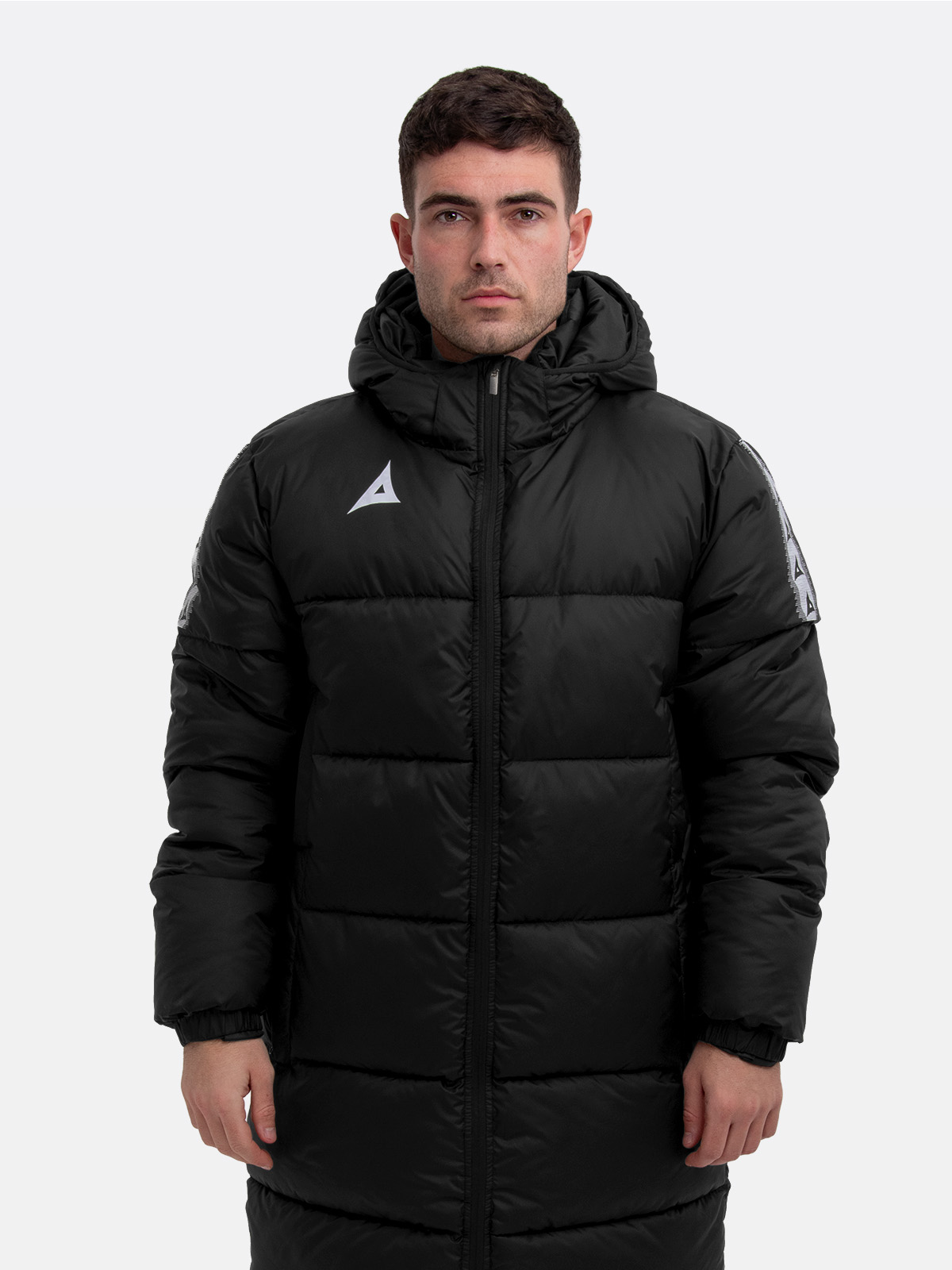 male model wearing the avec evolve pro bench coat in black, featuring insulated padding a minimal design for premium warmth and comfort
