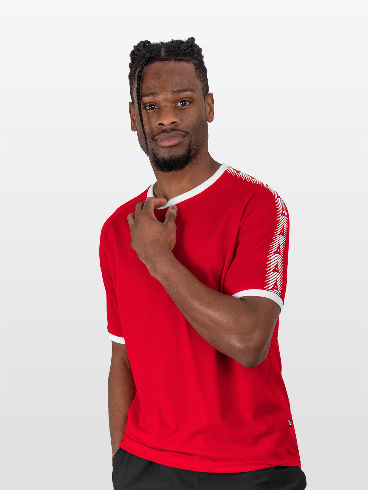 a male model wearing the avec evolve red t-shirt, plain red top with ribbed sleeve cuff and neck