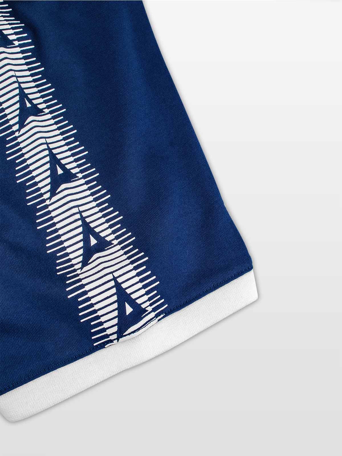 close-up of avec heritage 'a' logo taping on the avec evolve navy t-shirt