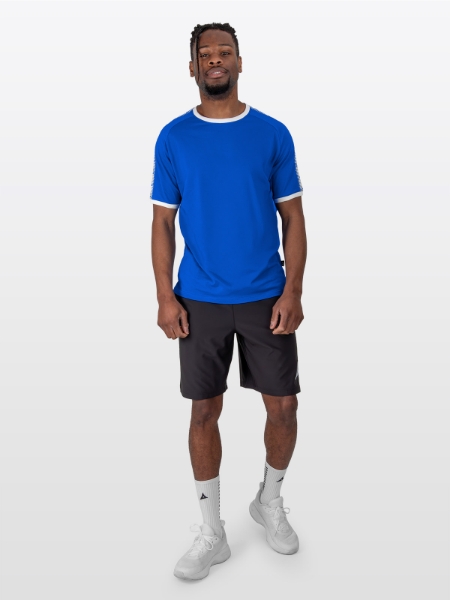 A Male Model is stood wearing the Avec Evolve Royal Blue T-Shirt, and Black Avec Focus 2 Tech Shorts and Avec Grip socks in white