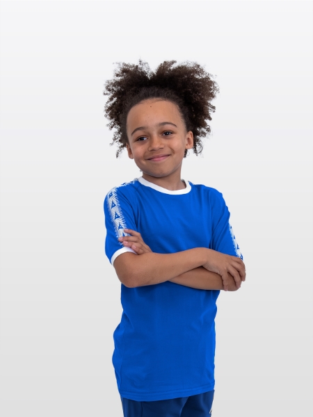 A boy is stood wearing wearing the Avec Evolve Royal Blue T-Shirt, plain Royal blue top with sleeve detail