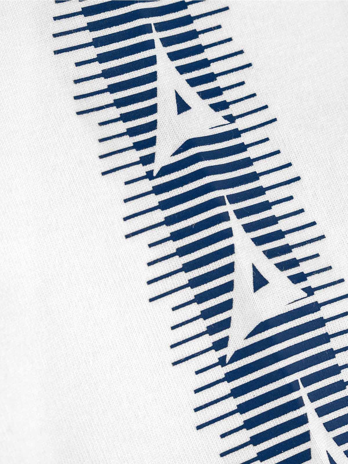 close-up of avec heritage 'a' logo taping on the avec evolve white t-shirt