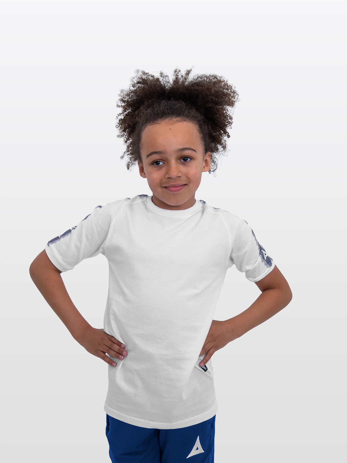 a boy is stood wearing wearing the avec evolve white t-shirt, plain white top with navy blue sleeve detail