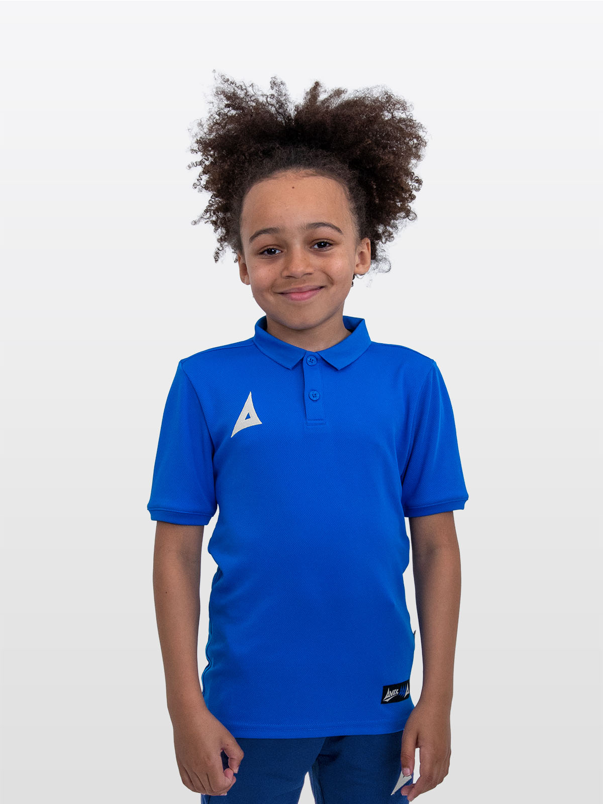 a young boy is wearing the avec focus 2 royal tech polo