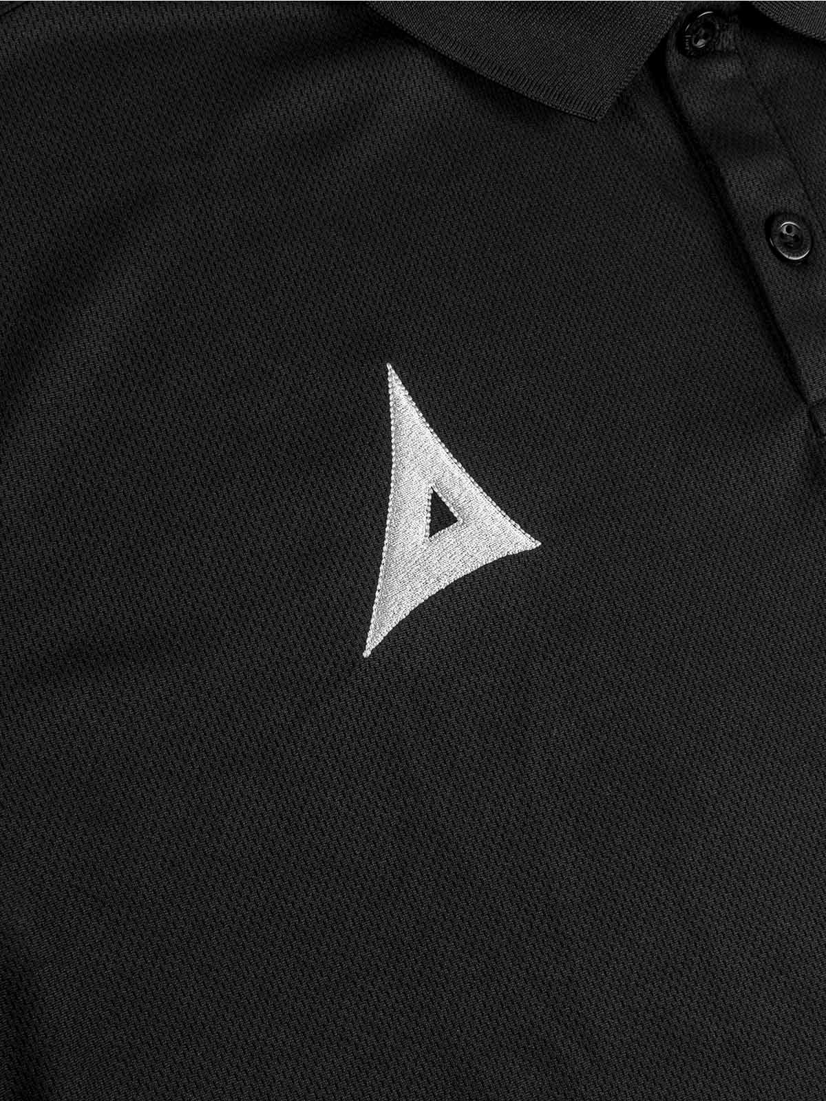close-up of avec heritage 'a' embroidered logo on the avec focus 2 black tech polo