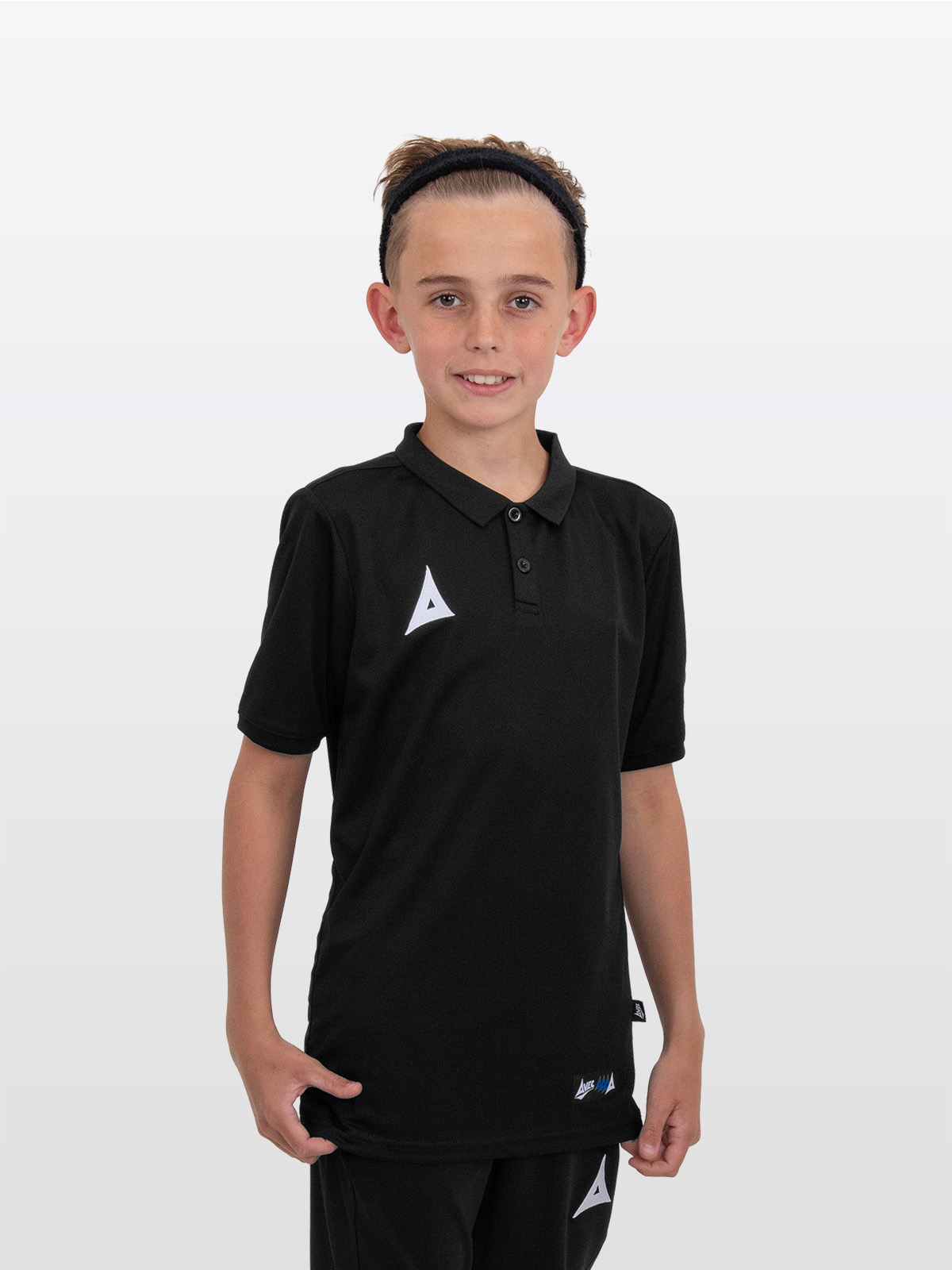 a young model is stood wearing the avec focus 2 black  tech polo