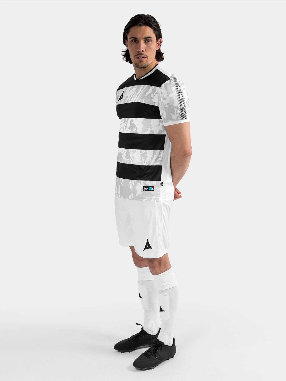 full body kit view of the black and white pro intent jersey, styled with matching teamwear shorts and socks.