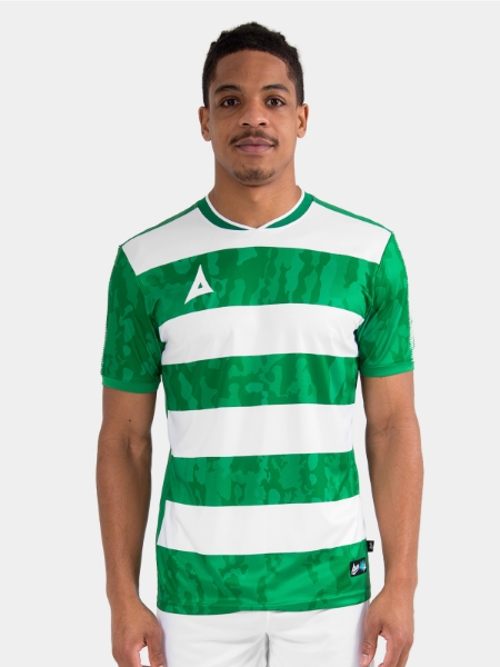 Lifestyle shot of a model wearing the Green and White Pro Intent Jersey, focusing on the comfortable athletic fit.