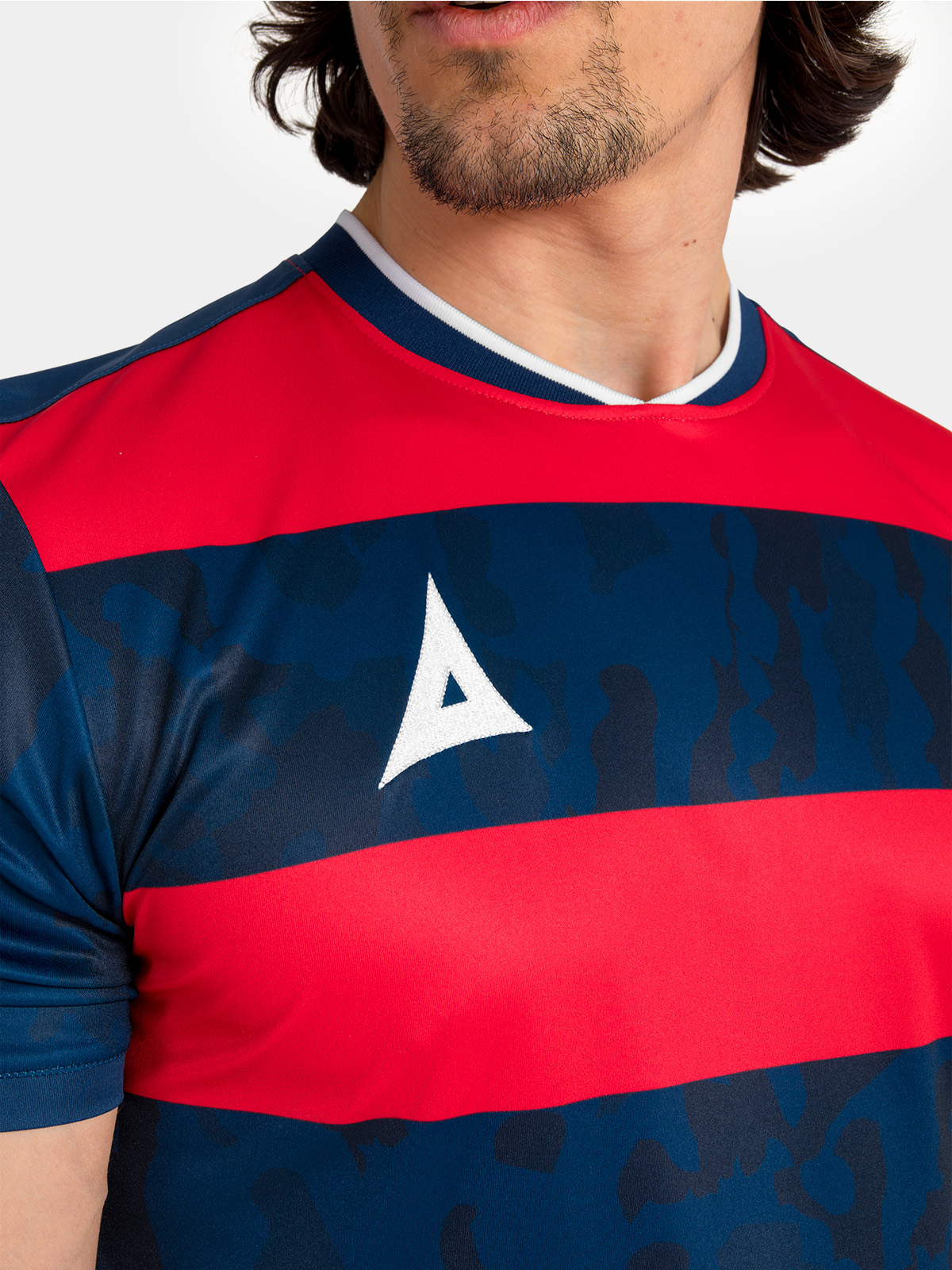 technical shot of the navy and red collar and neck label, designed for comfort during high-intensity play.