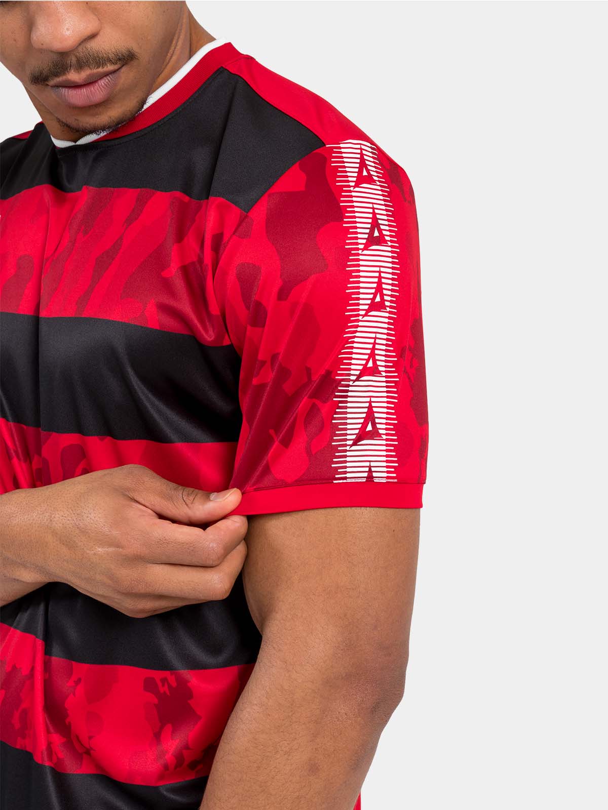 close-up of the red and black jersey sleeve with the signature heritage contrast panel and camo texture.